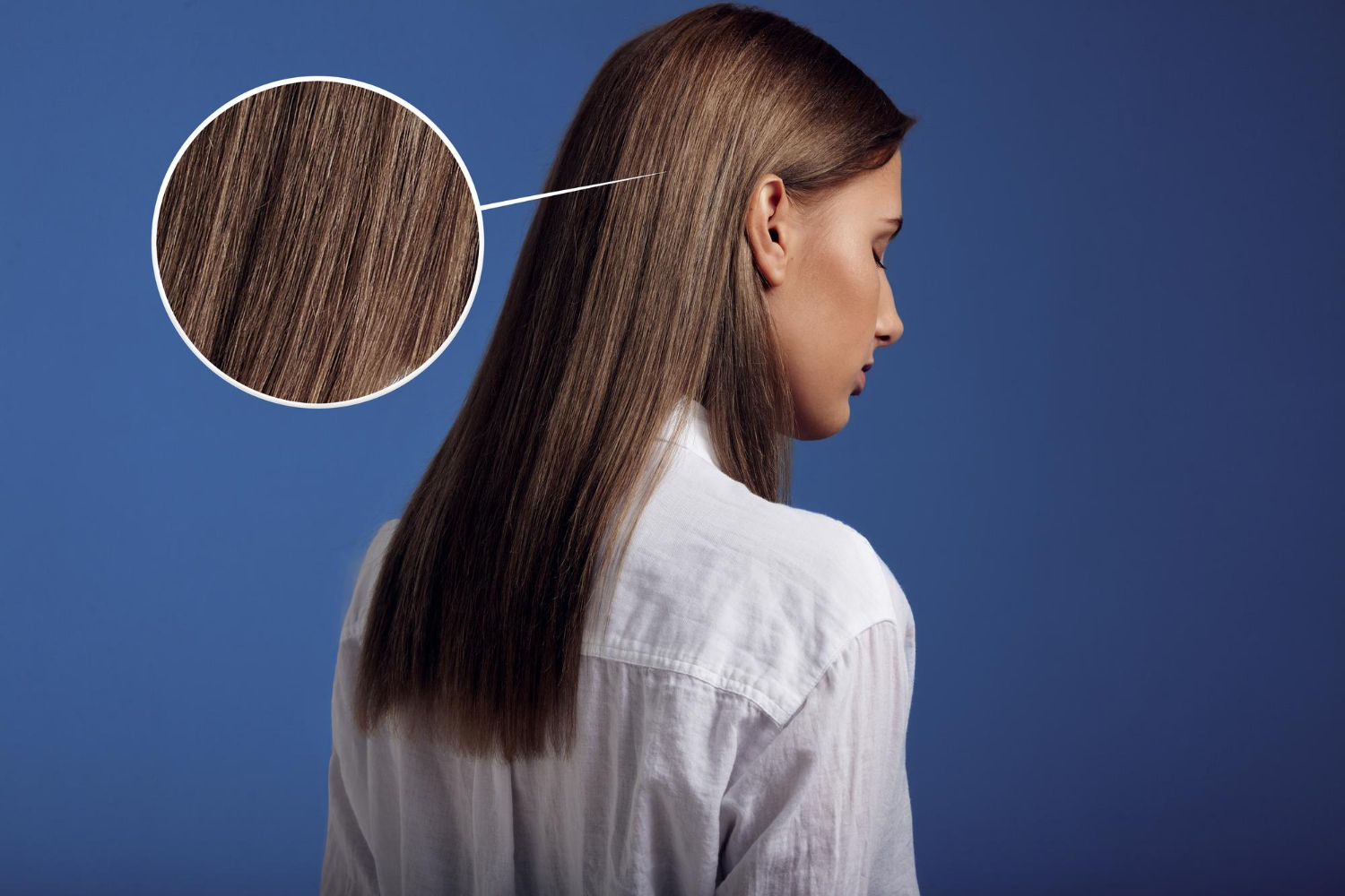 Woman wears white shirt from backside showing ideal straight hair<br />